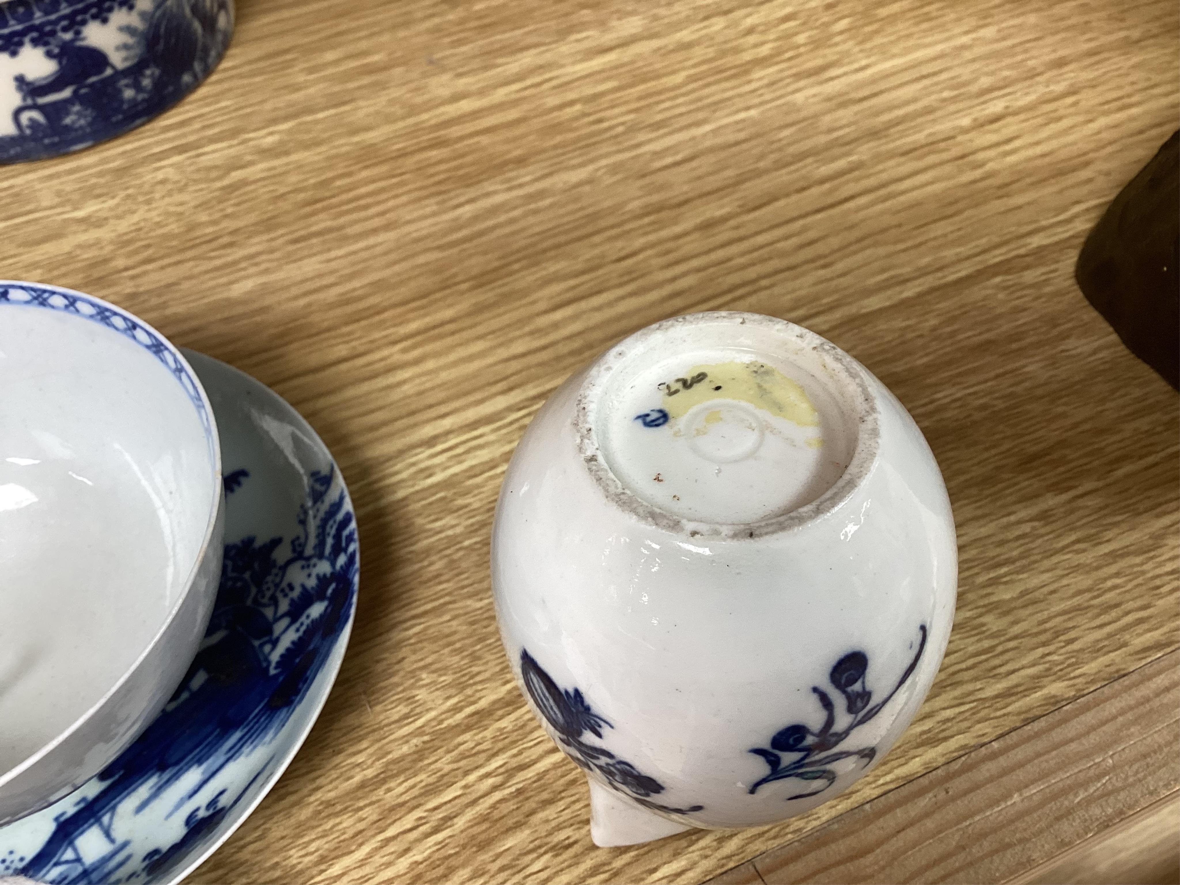 A group of 18th century Worcester and Liverpool porcelain teaware and a Caughley Cormorant fisherman butter tub and cover.